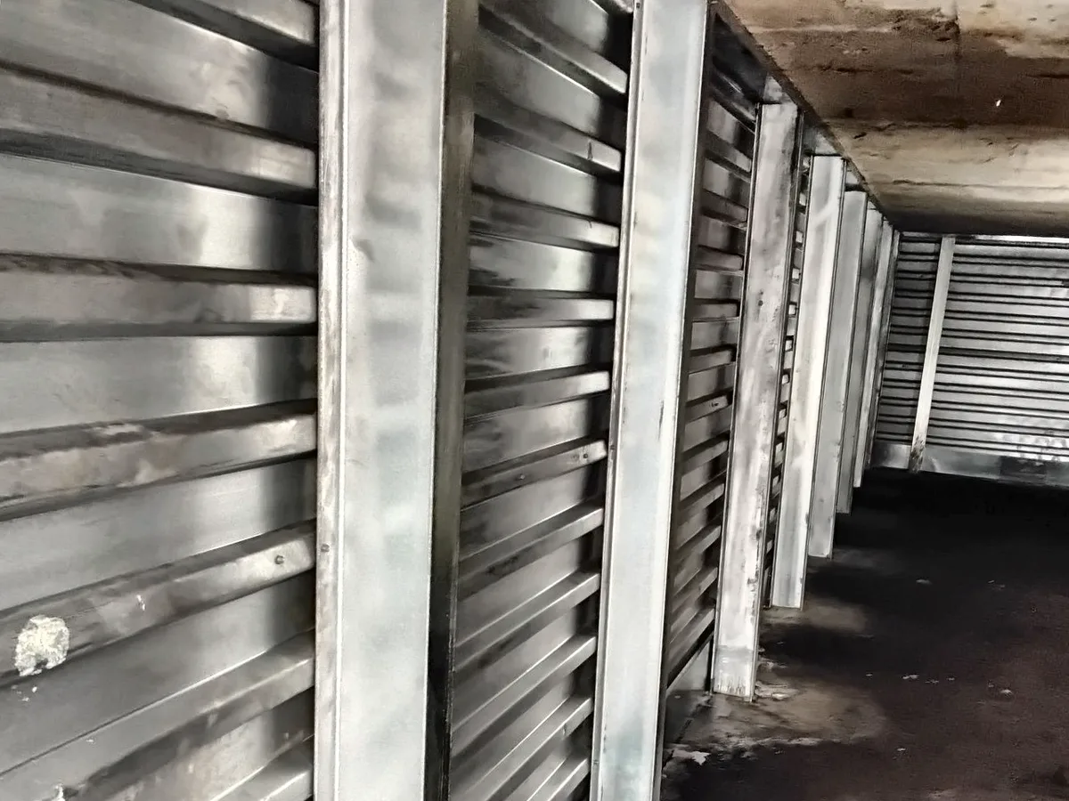 The same crawl space wall after full-height galvanized steel wall braces were installed
